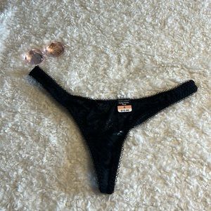 Black lace thong with adorable crystal design